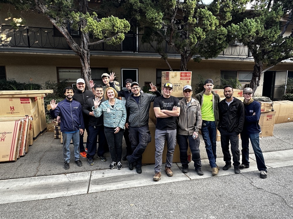 Volunteers wave.