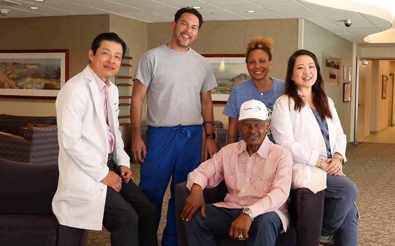 Manny Mota with care team